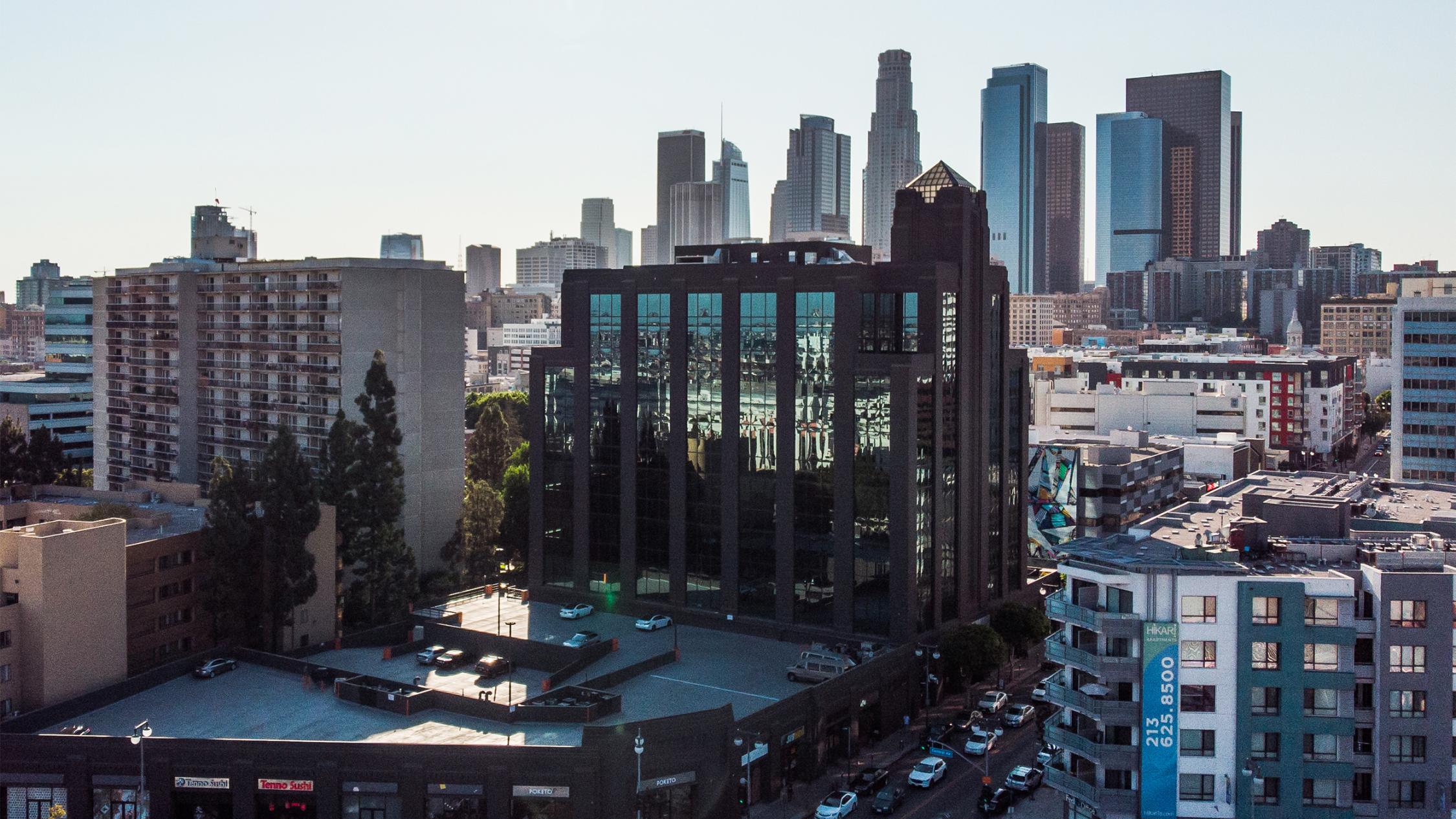 Brunswig Square exterior with skyline in background