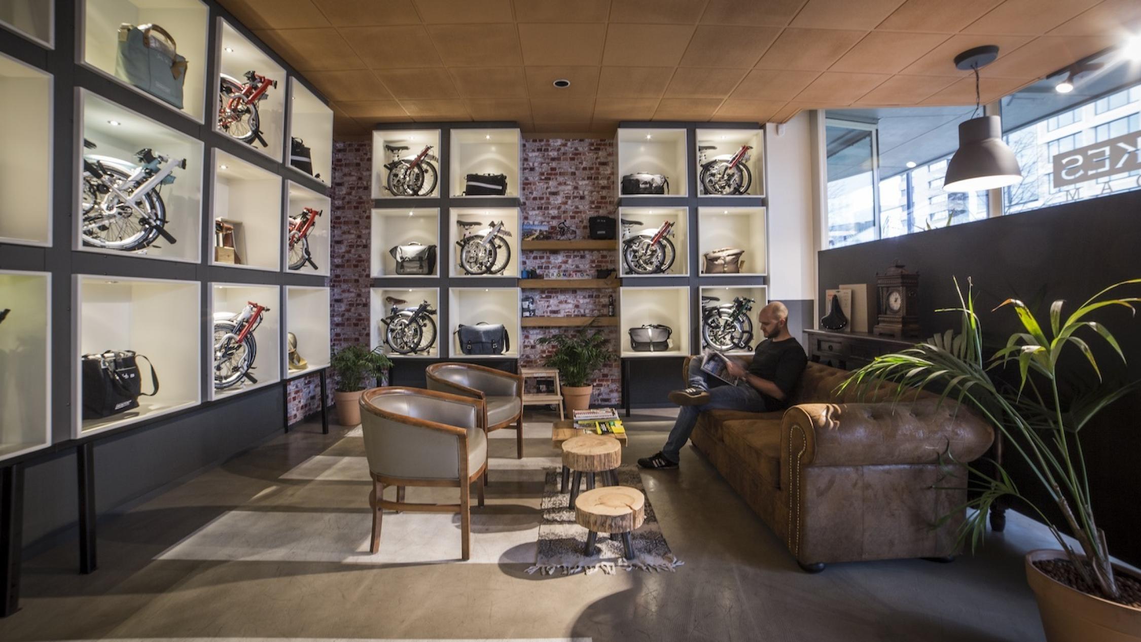 Groot Handelsgebouw interior common area with man sitting on sofa reading