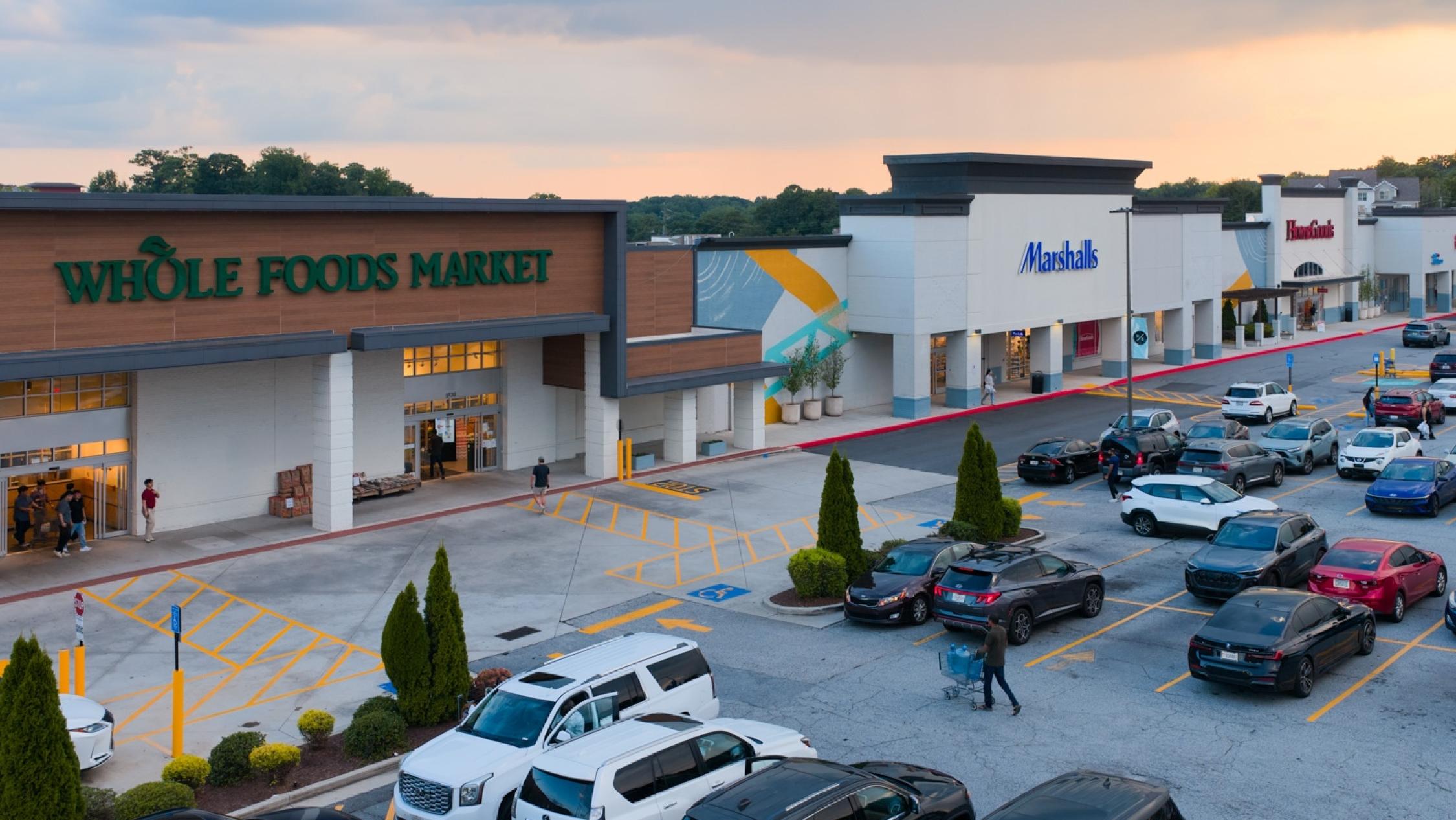 Low aerial view of storefronts and parking lot at Hammond Exchange