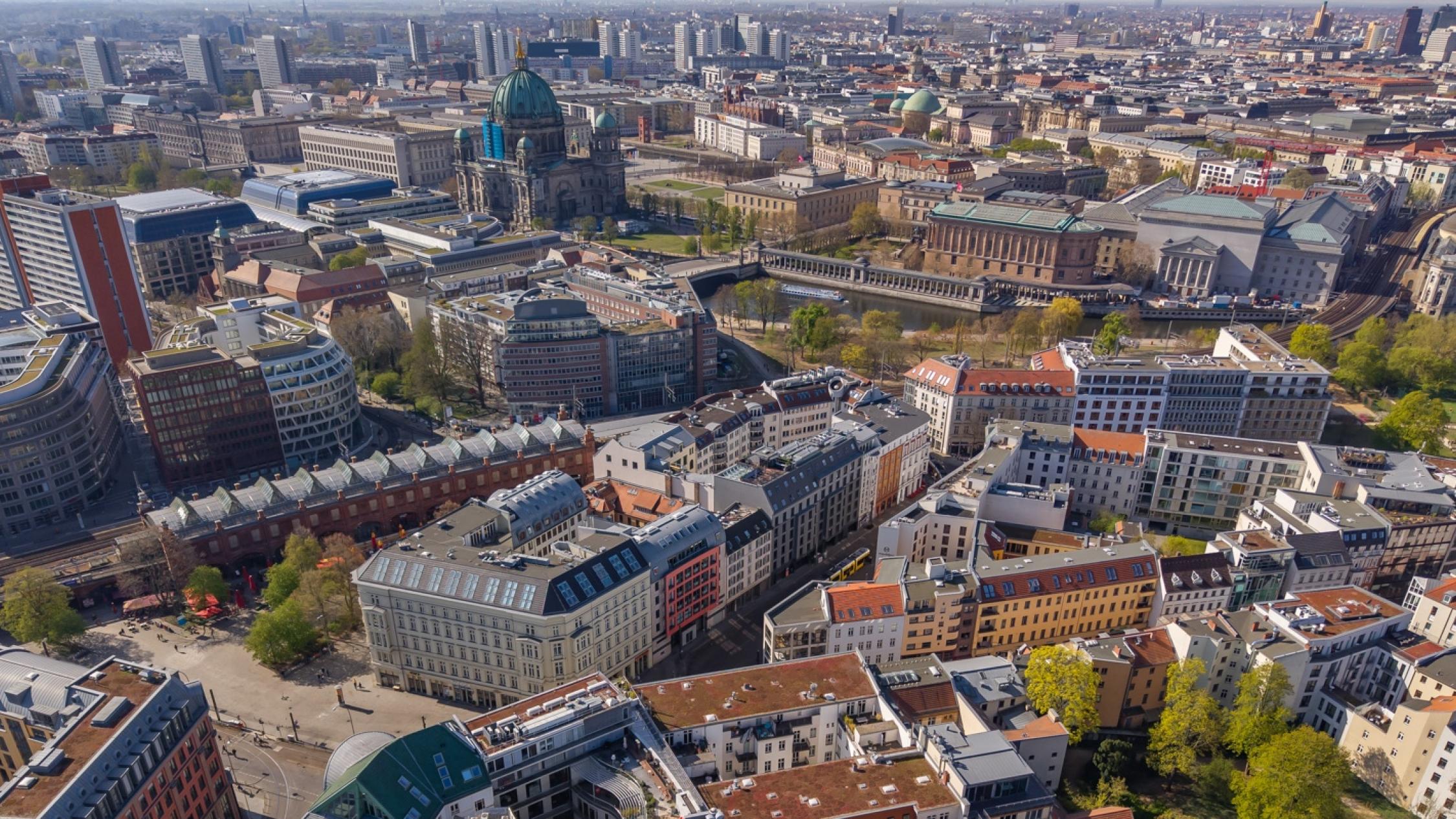 Aerial view of Oranienburger Straße with many surrounding buildings and midrise building in the background