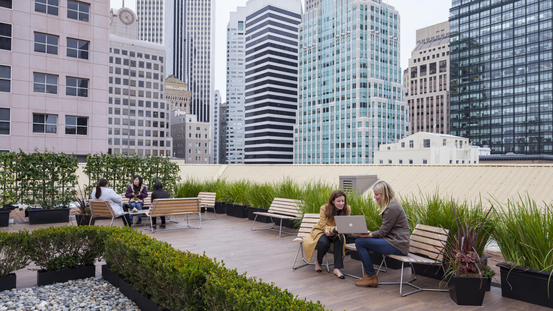 People utilizing the roof deck of Rialto on New Montgomery