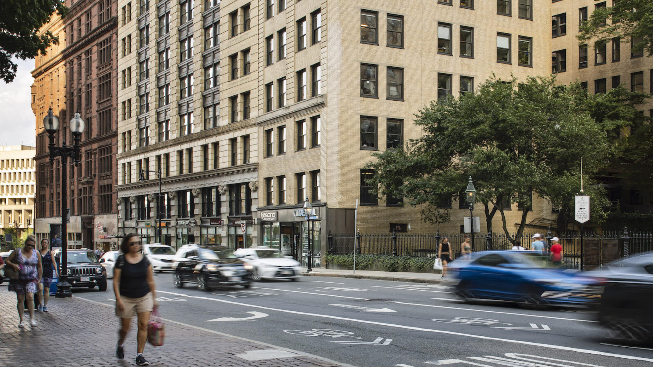 18 Tremont building facade with traffic and pedestrians in foreground