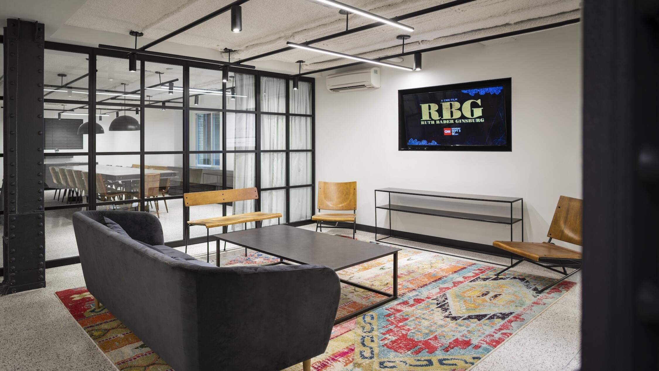 18 Tremont interior lounge common area with conference room in background