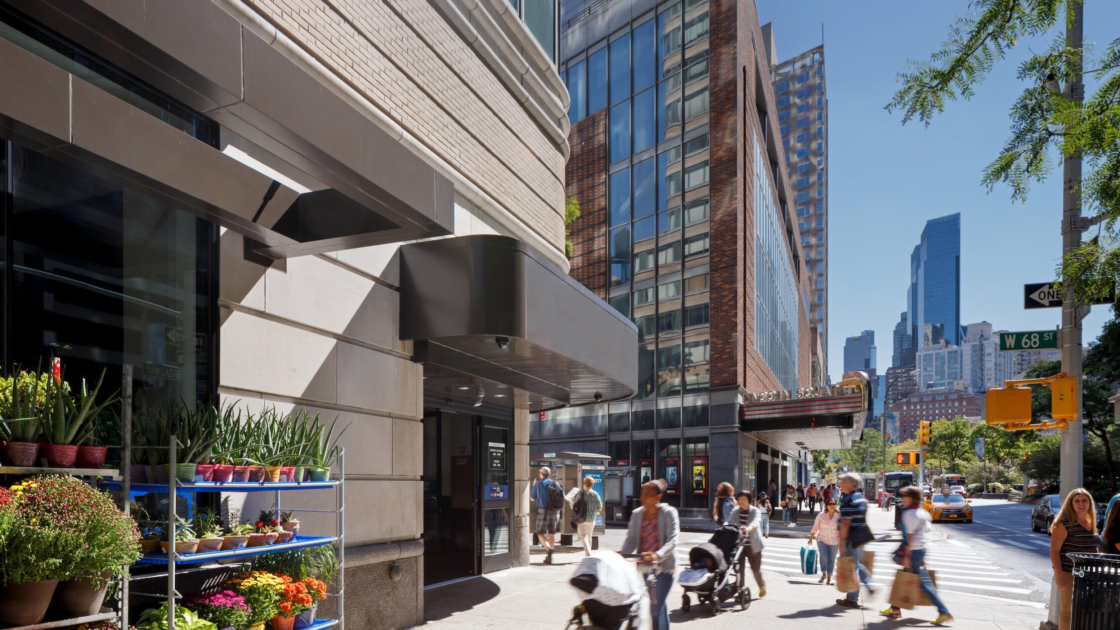 2000 Broadway retail store facade with pedestrians on sidewalk