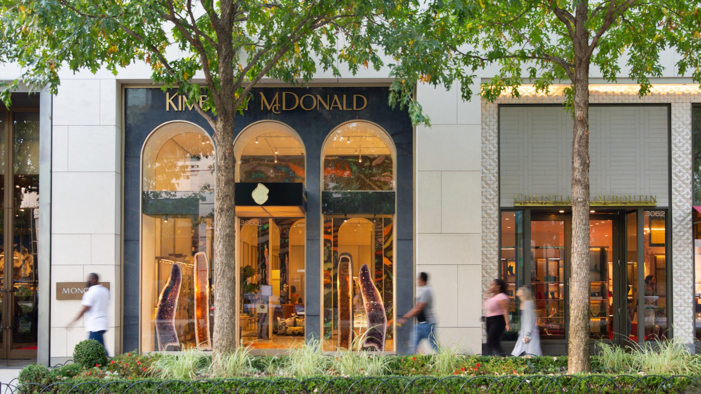 People pass a store at Buckhead Village District