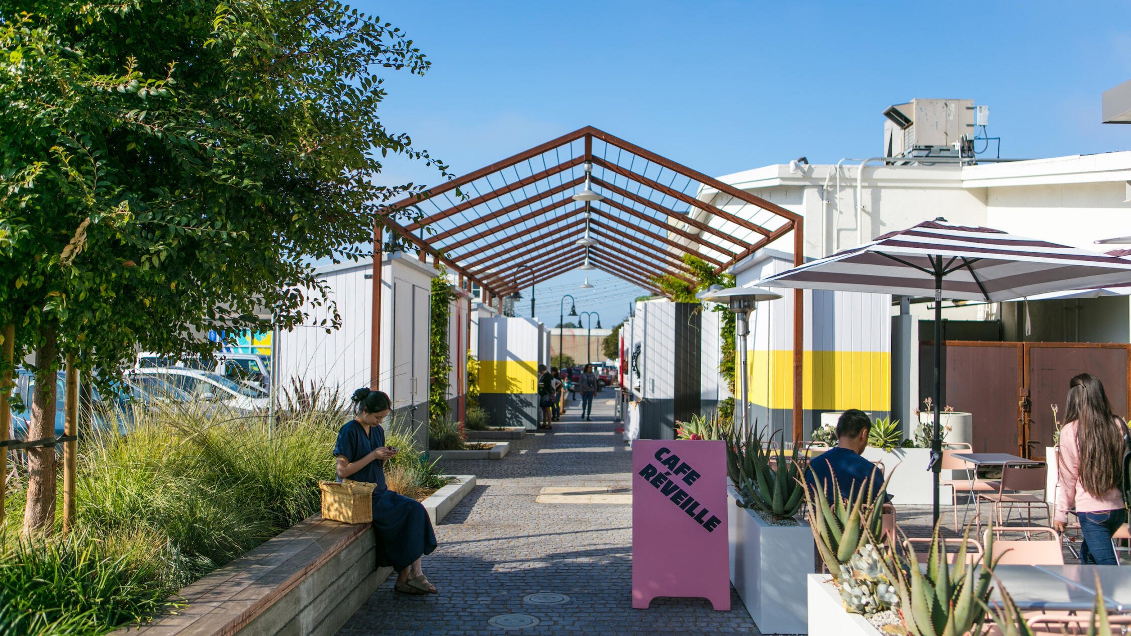 Fourth Street Berkely Maker's Row stalls with visitors in foreground