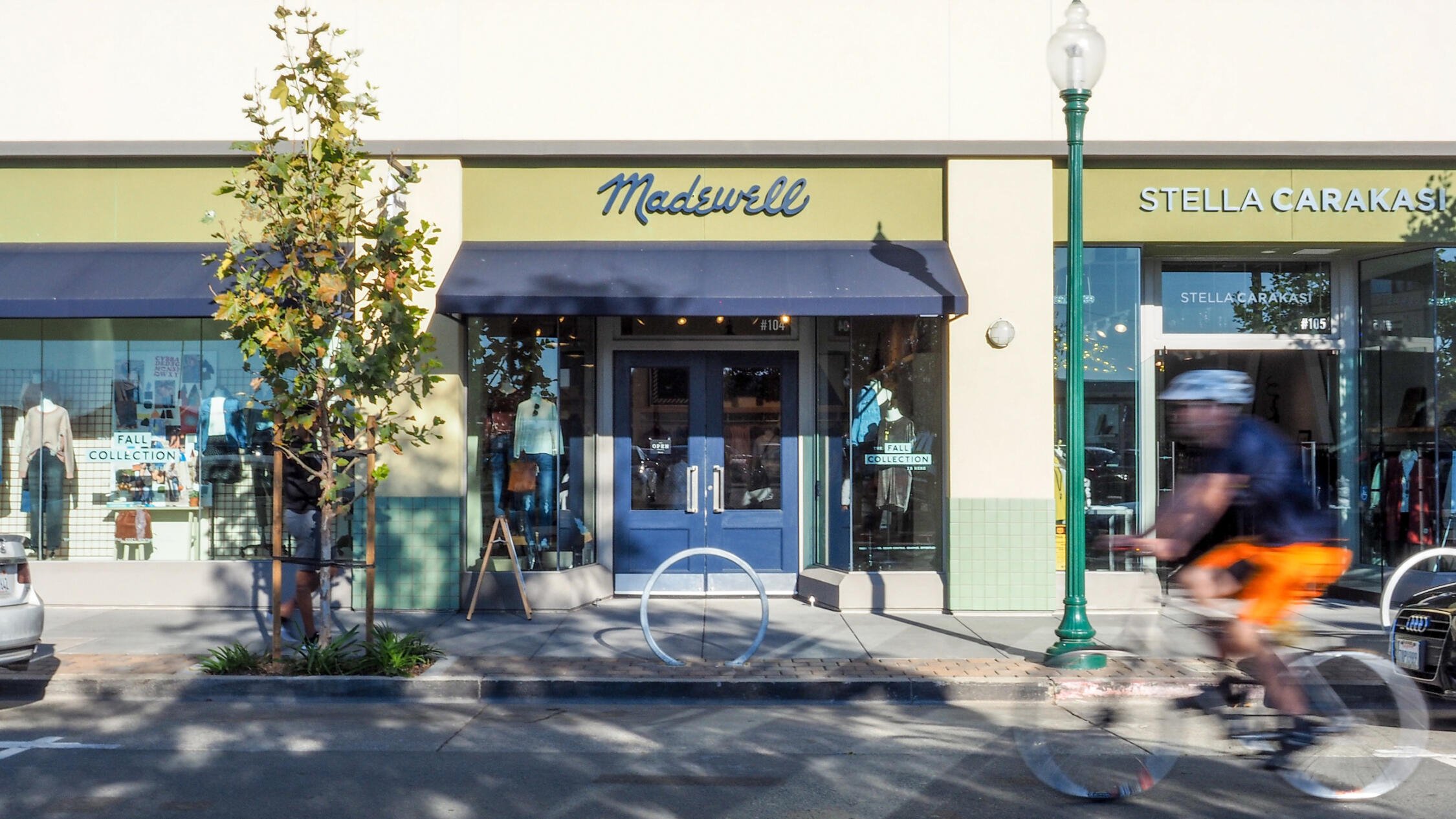 Fourth Street Berkeley retail store facades with bicyclist in street