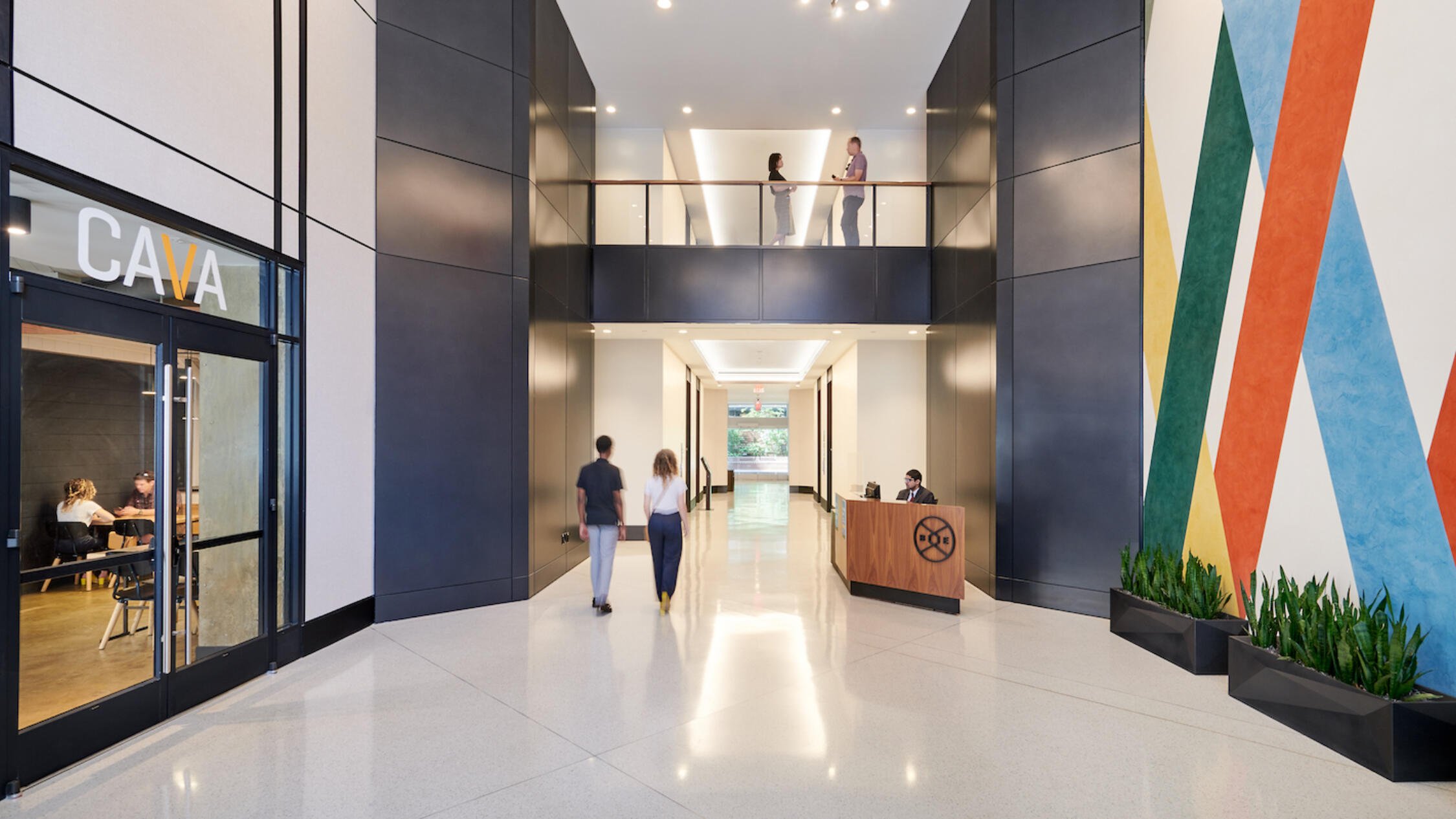 People pass through the bright lobby of Ballston Exchange