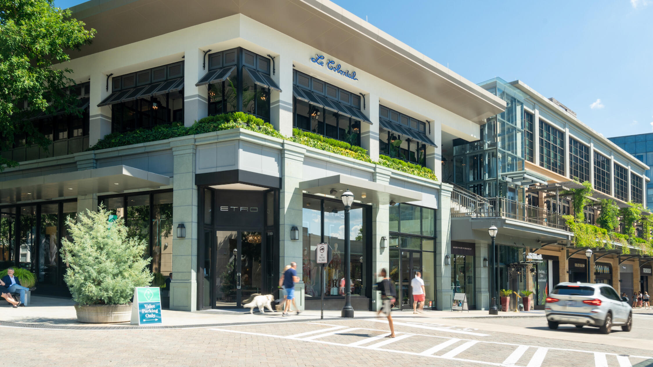 A bright clear day with people out at Buckhead Village District