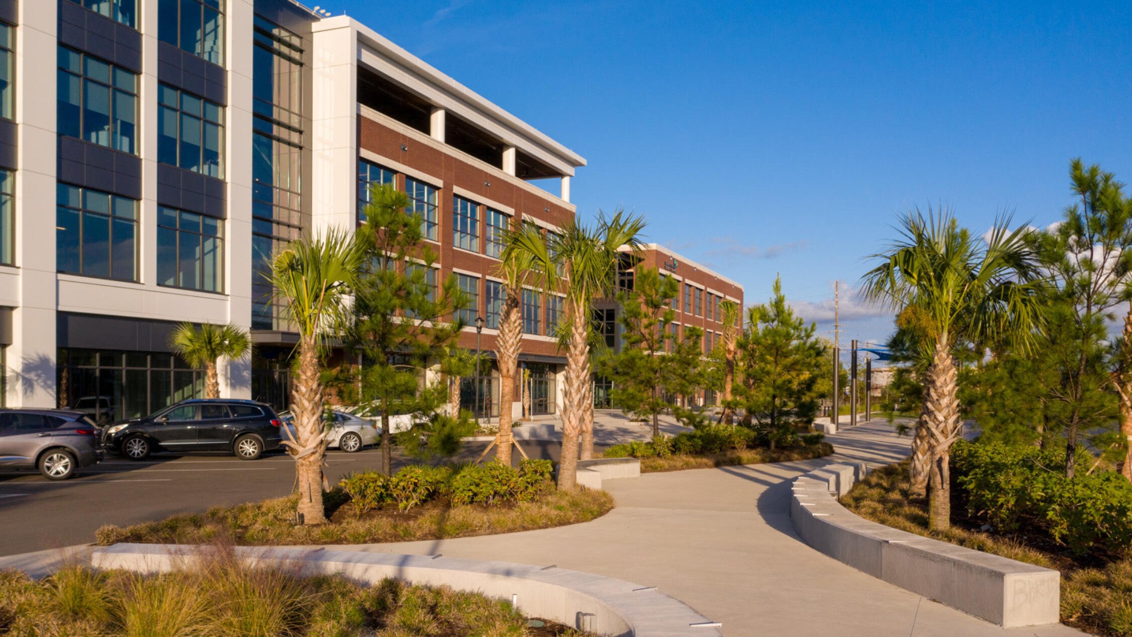 GARCo Mill facade with footpath and palm trees in foreground