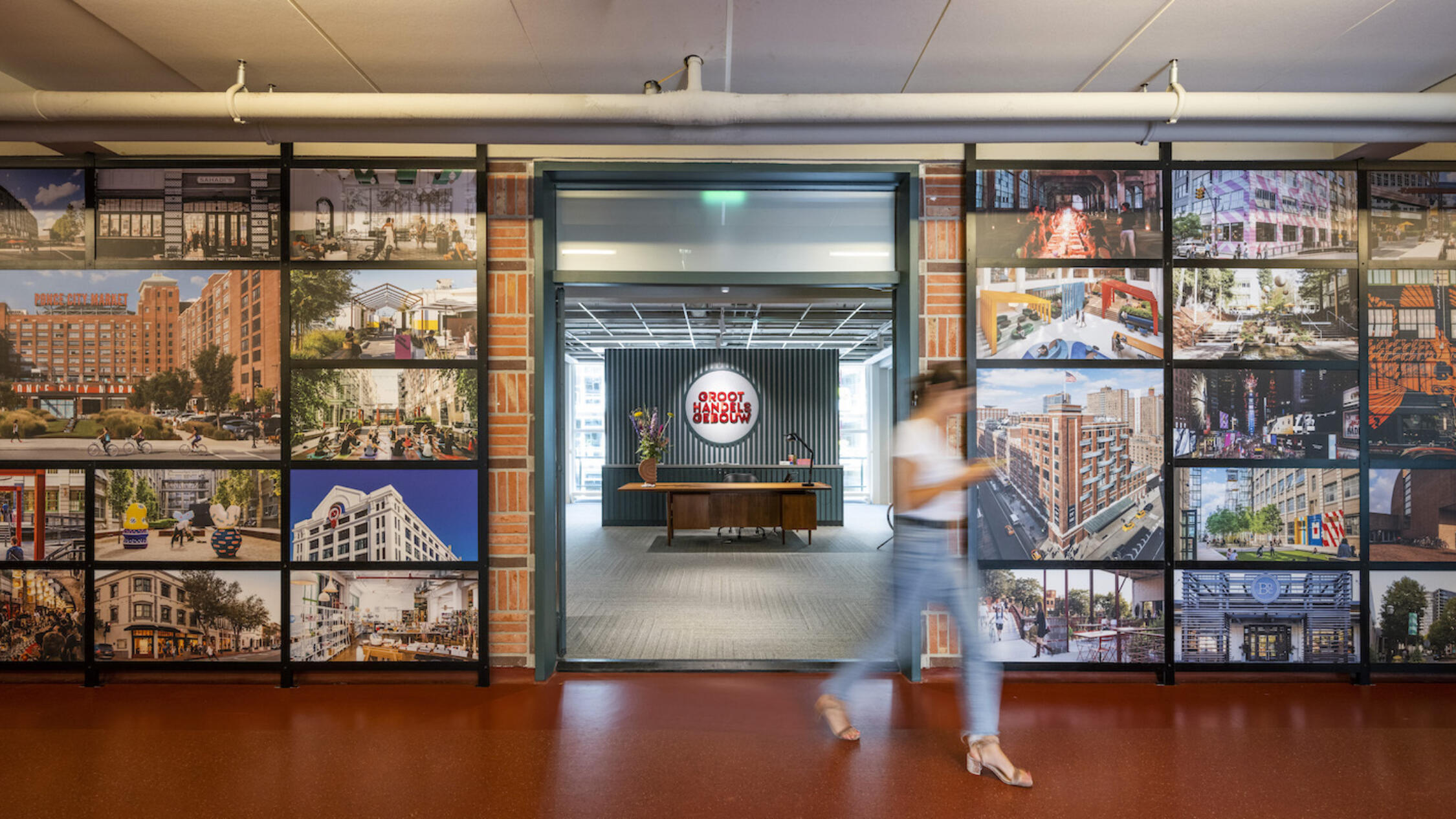 A woman walks in a hallway at Groot Handelsgebouw