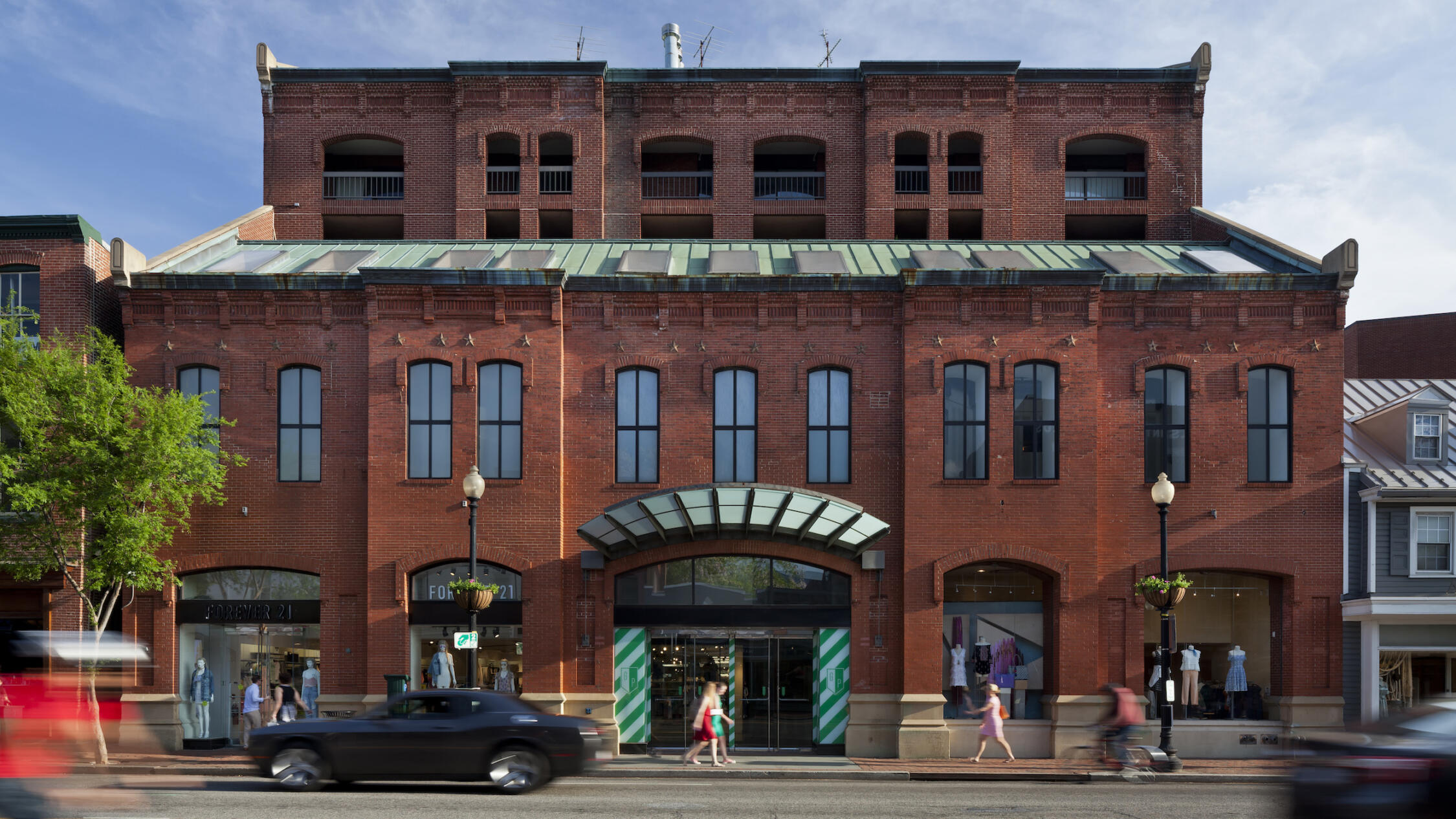 Georgetown Park retail shops exterior with cars and pedestrians in foreground