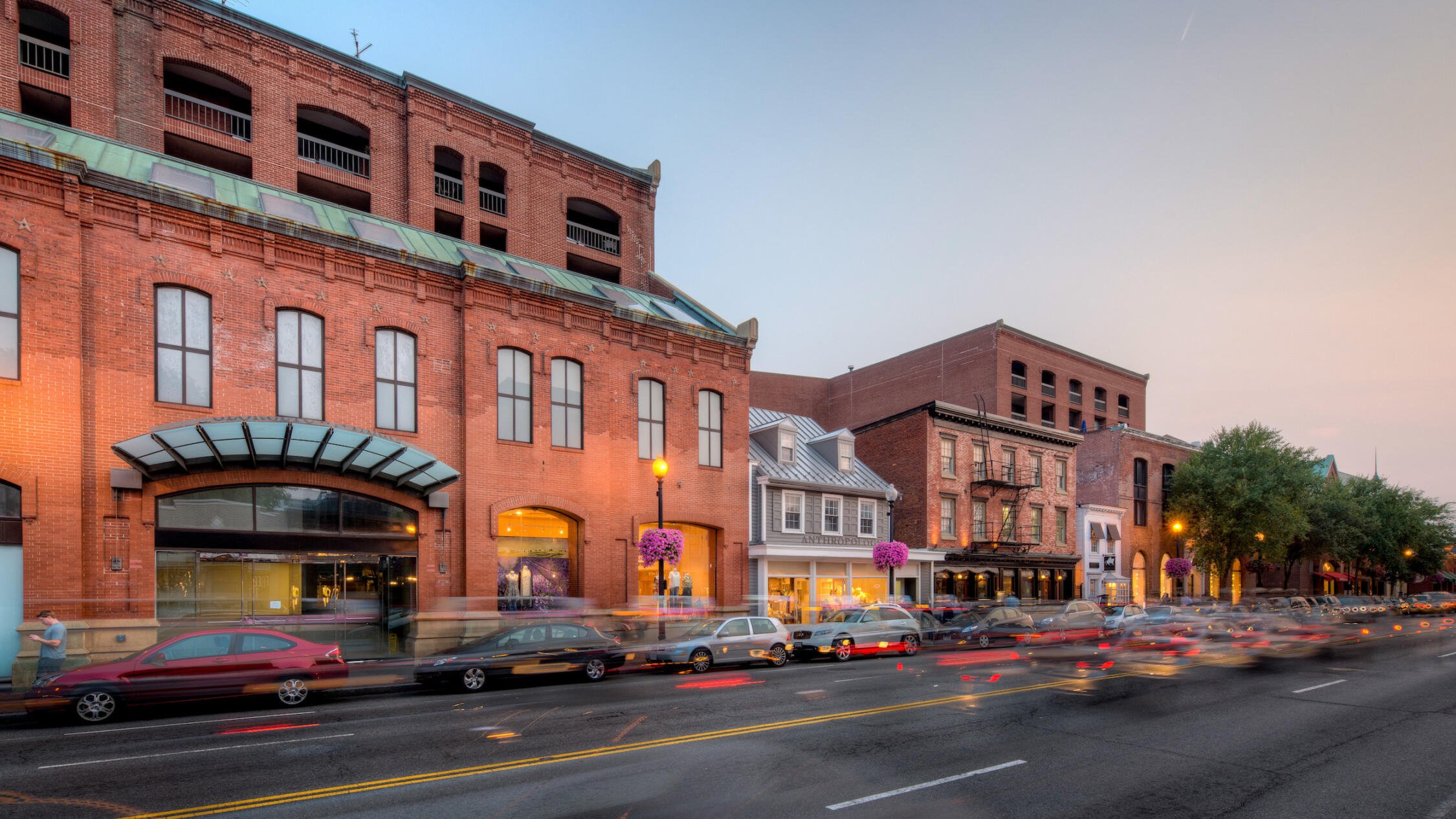 Georgetown Park retail shops exterior at sunset with cars in foreground