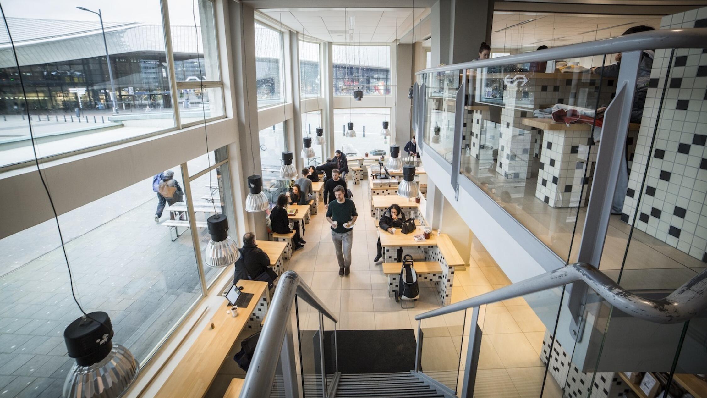 Groot Handelsgebouw interior common area with people working at tables