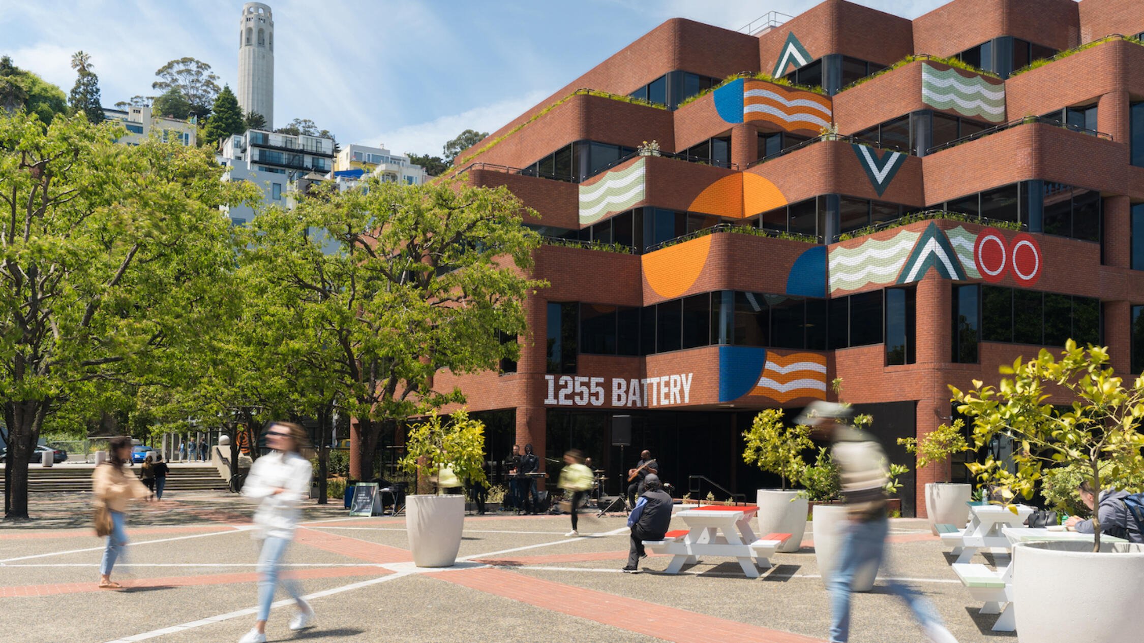 People walk by outside Levi's Plaza