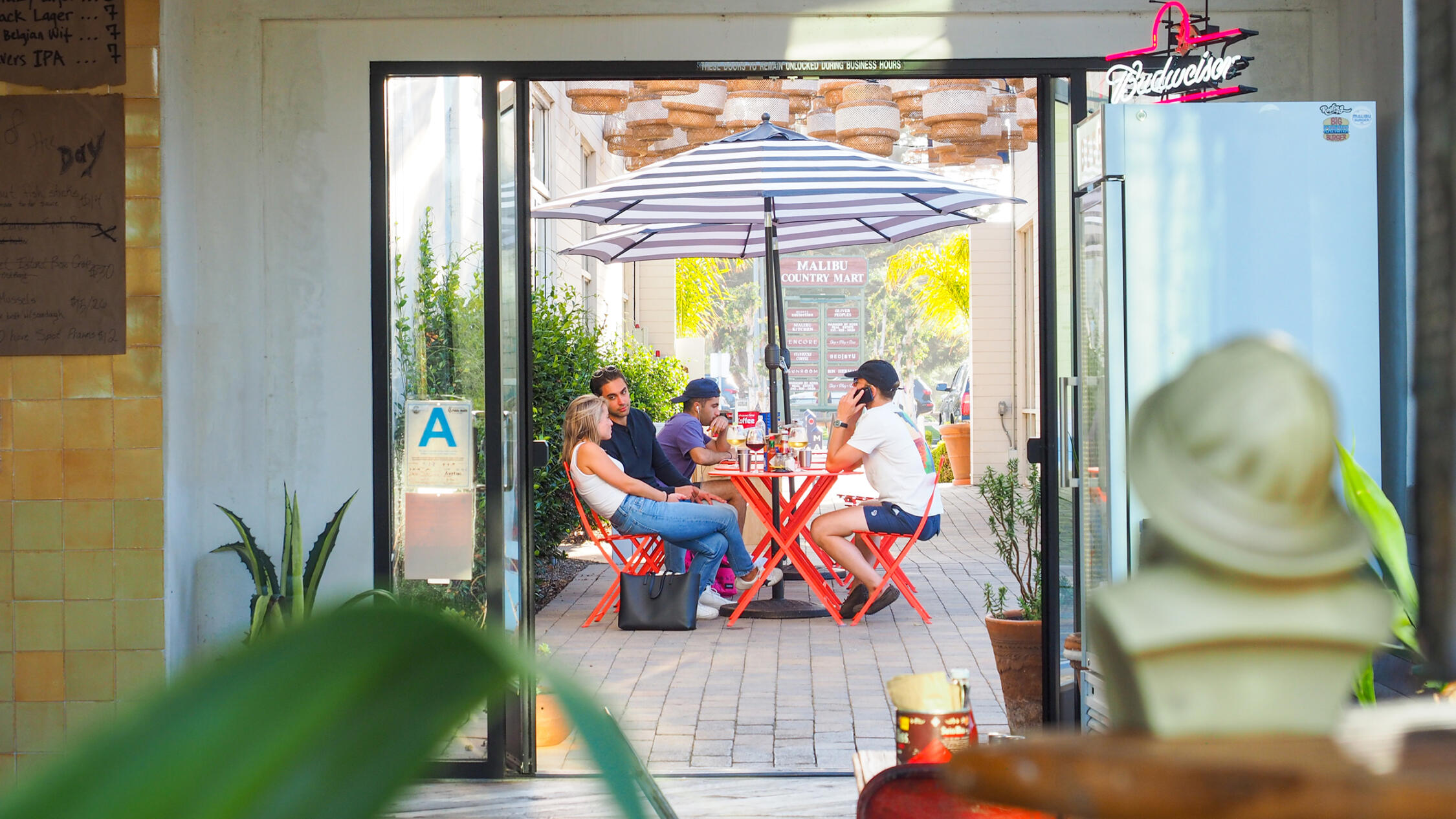 People dining at a patio cafe