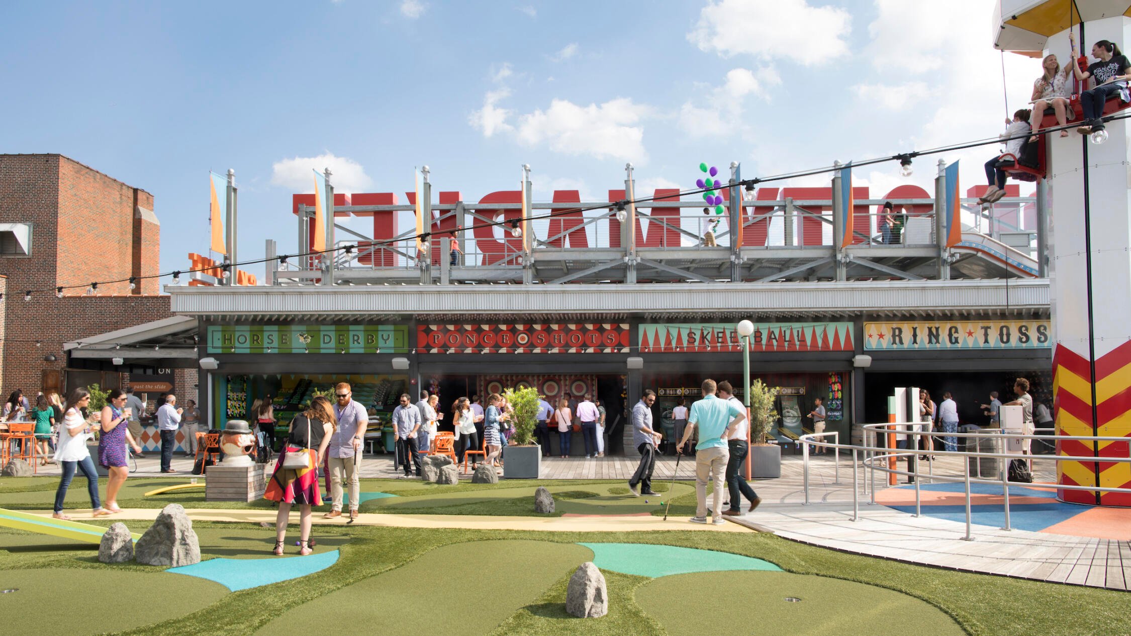 Rooftop of Ponce City Market with people enjoying the amusement park