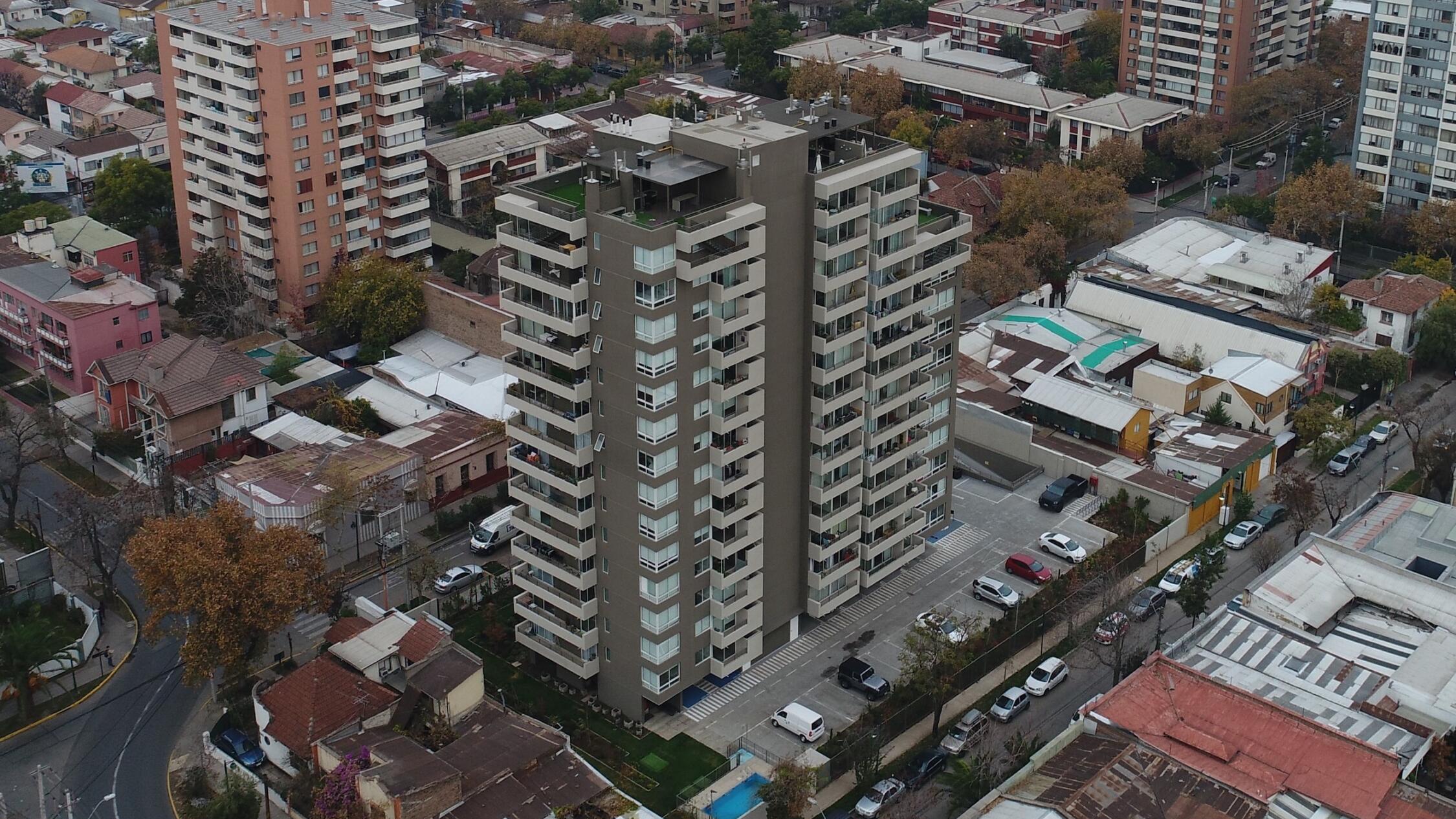 Brown and white apartment building from above