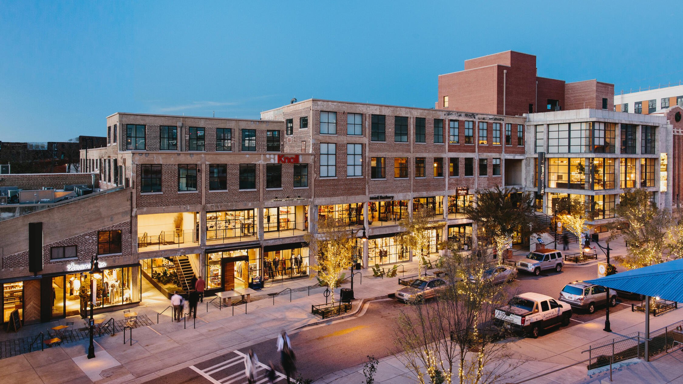 Elevated view of Westside Provisions District at evening with people crossing the street