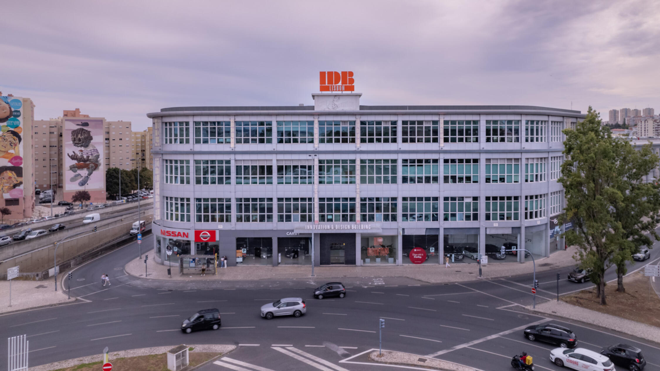 IDB Lisbon building facade with cars on street in foreground