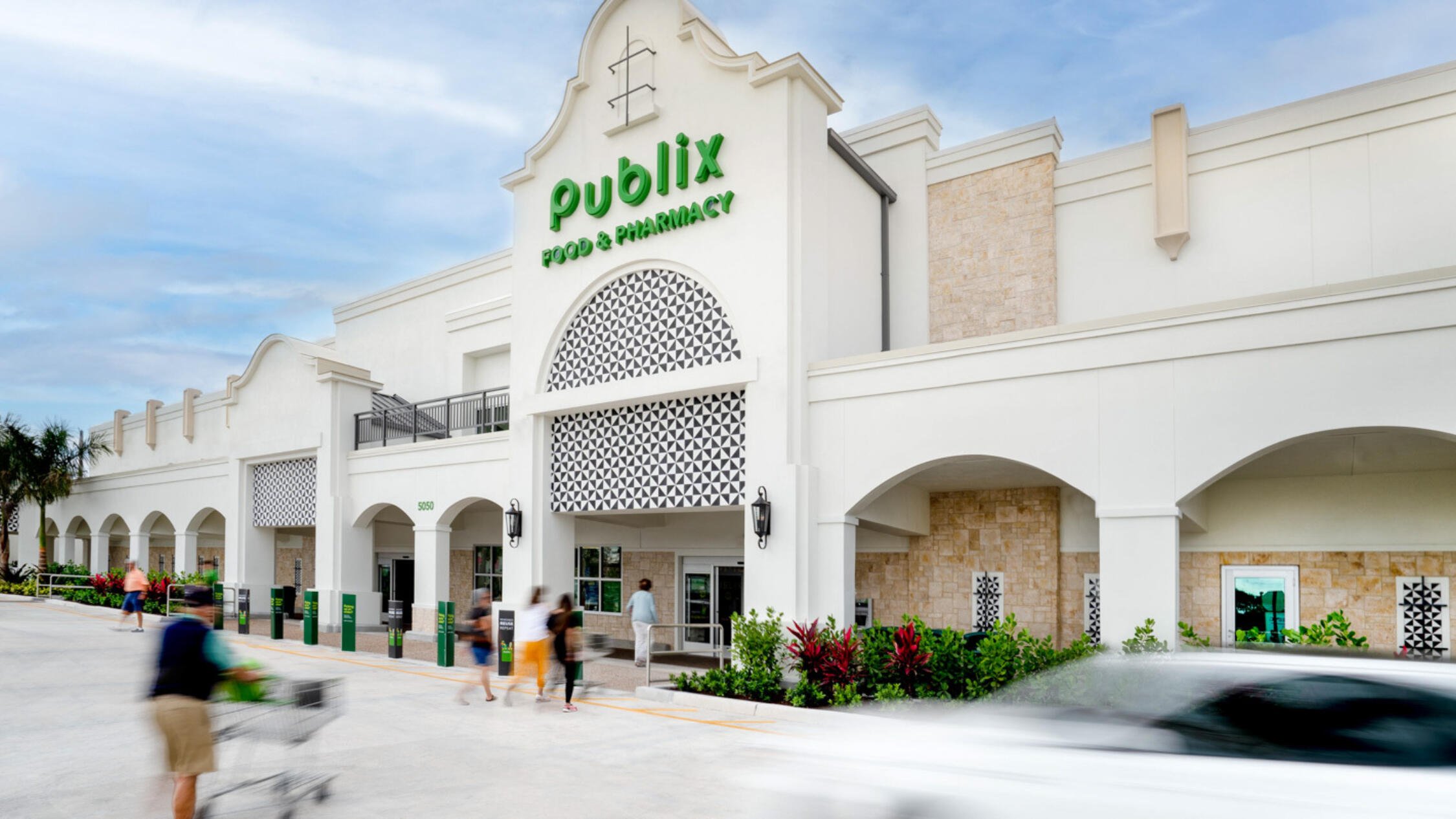 Shoppers approaching the main entrance of Publix at Polo Club Shops