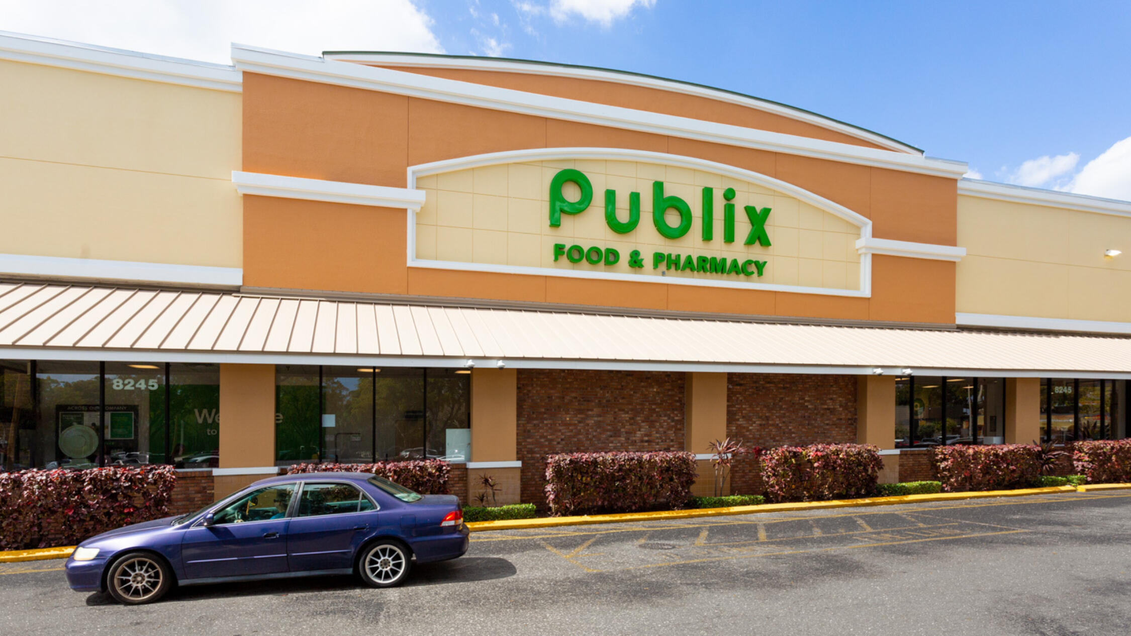 Publix Façade at Tamarac Town Square with car on driveway in front