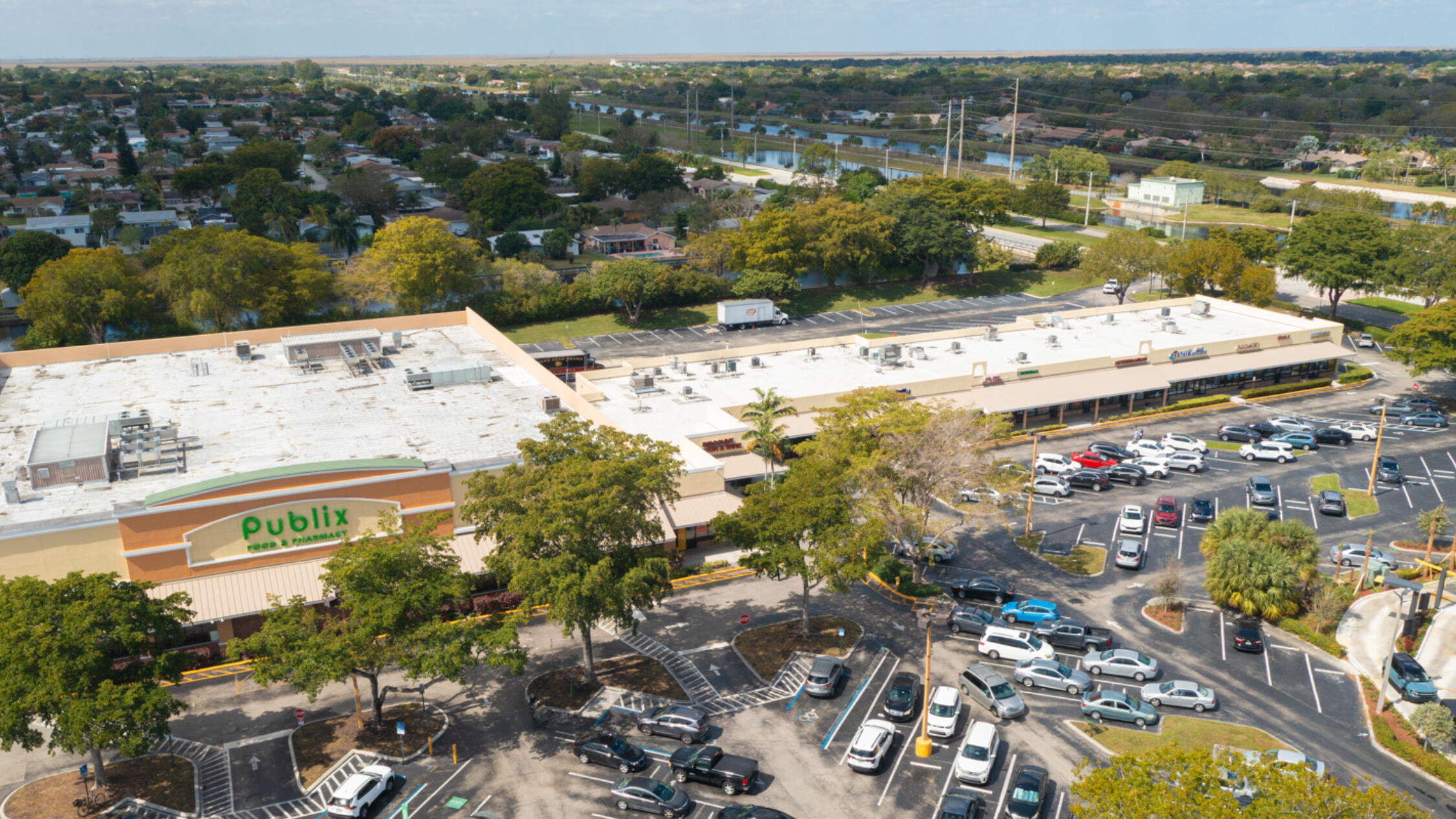 Aerial view of Tamarac Town Square including parking lot and neighborhood in background
