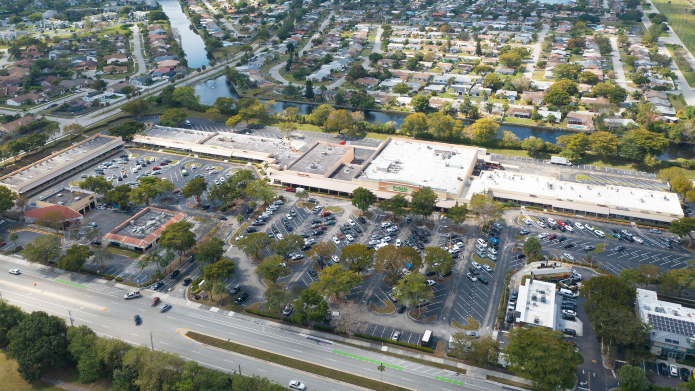 Aerial view of Tamarac Town Square including main road in front and neighborhood in background