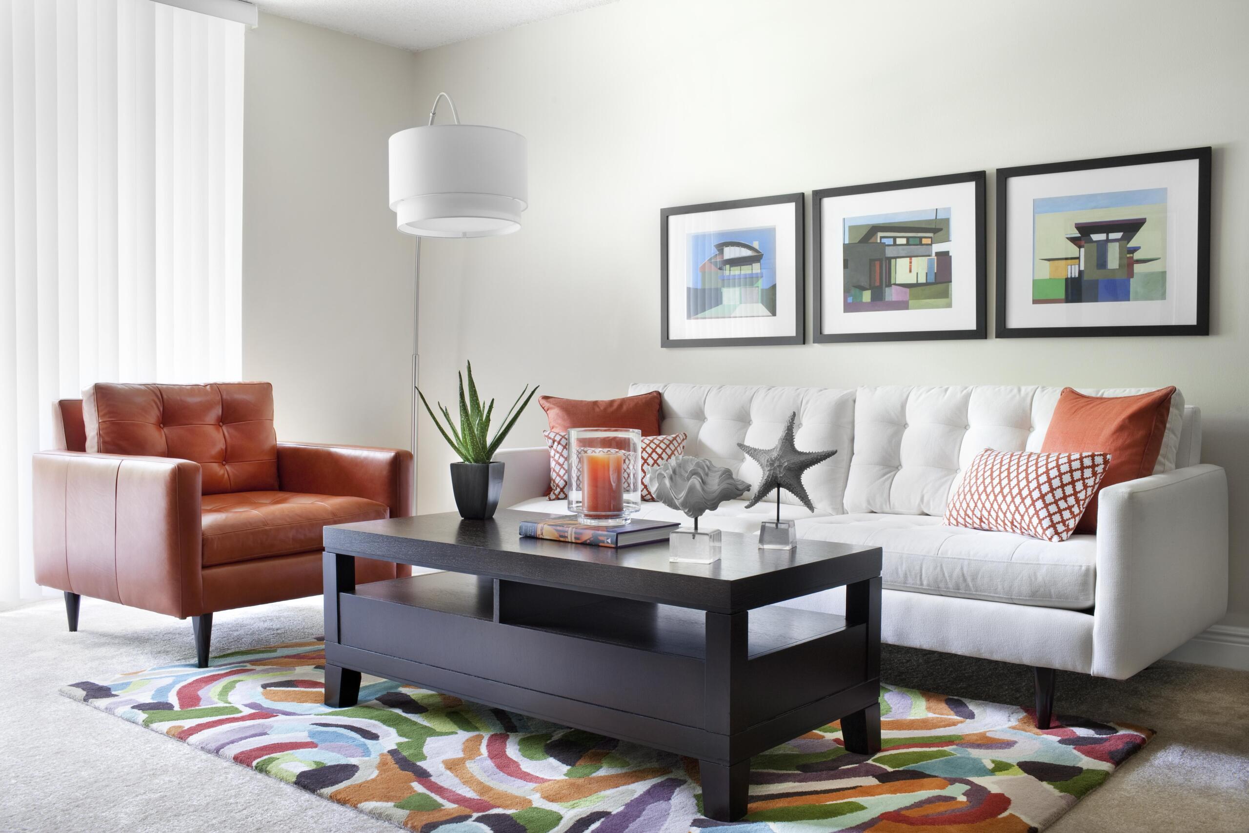 Beach Place apartment living space interior with sofa, chair, and coffee table