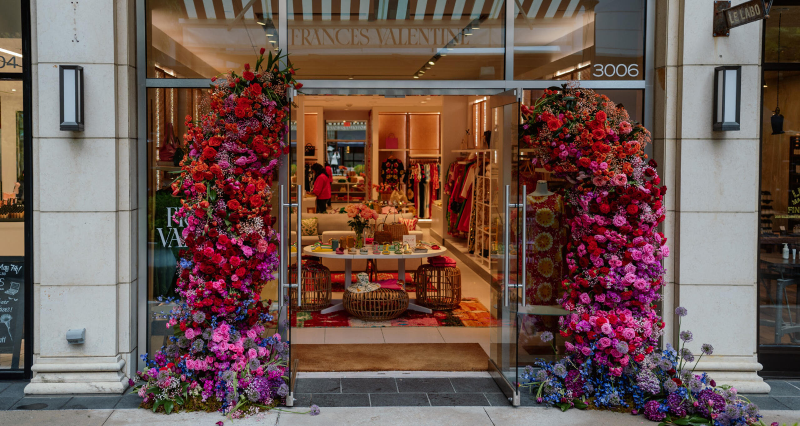Storefront at Buckhead Village decorated with flowers for Bodacious Blooms festival