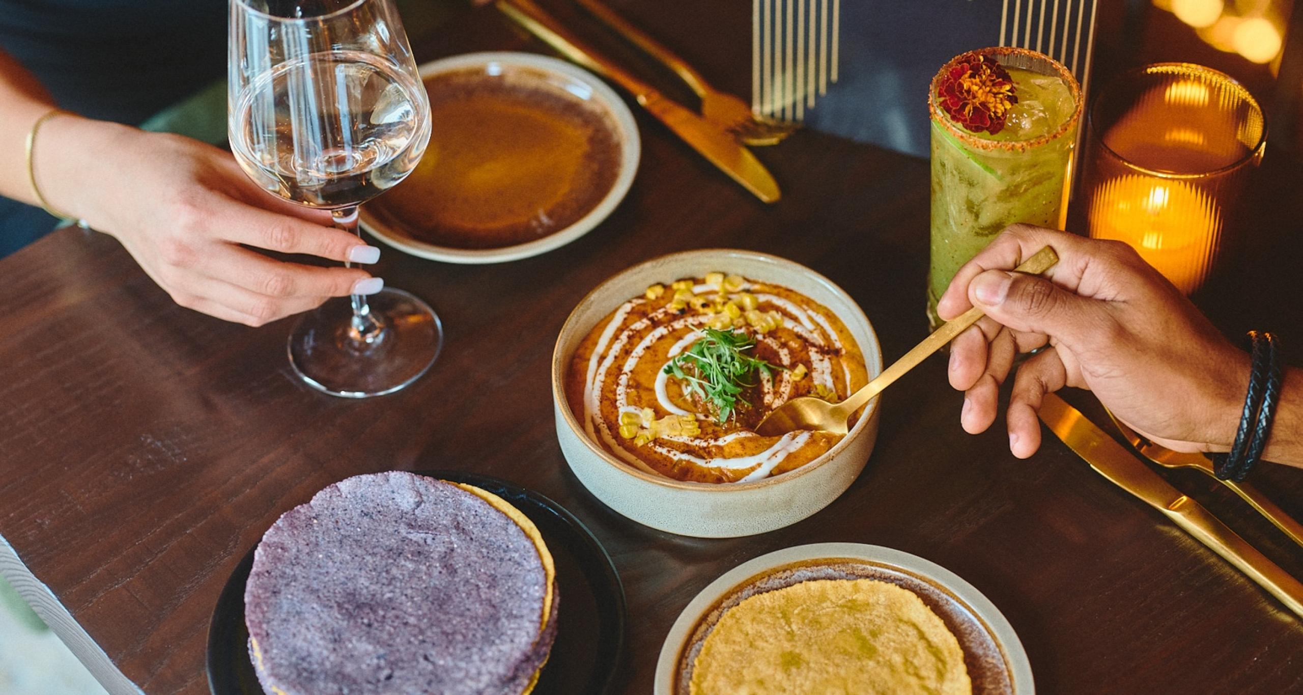 Closeup of food on a dining table at Cuevacía at Colony Square