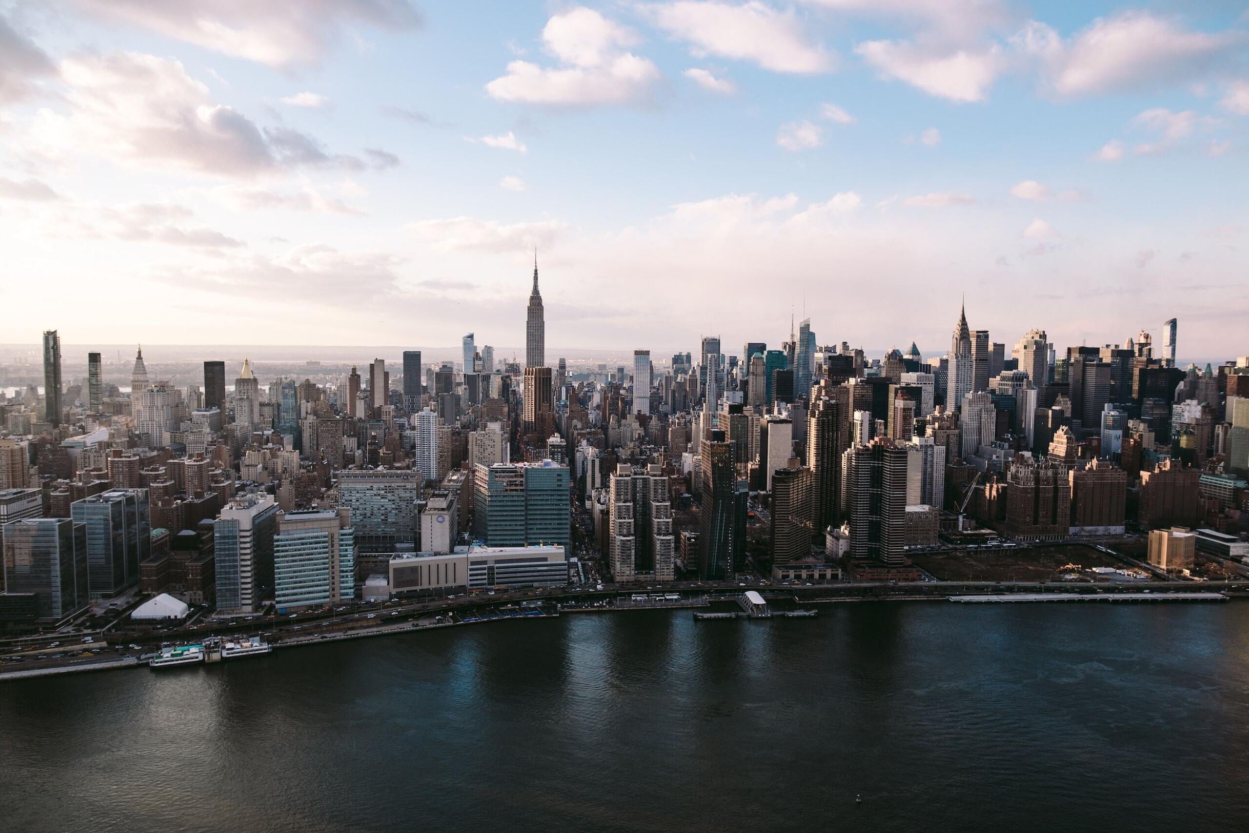 Aerial view of Manhattan skyline with river in foreground