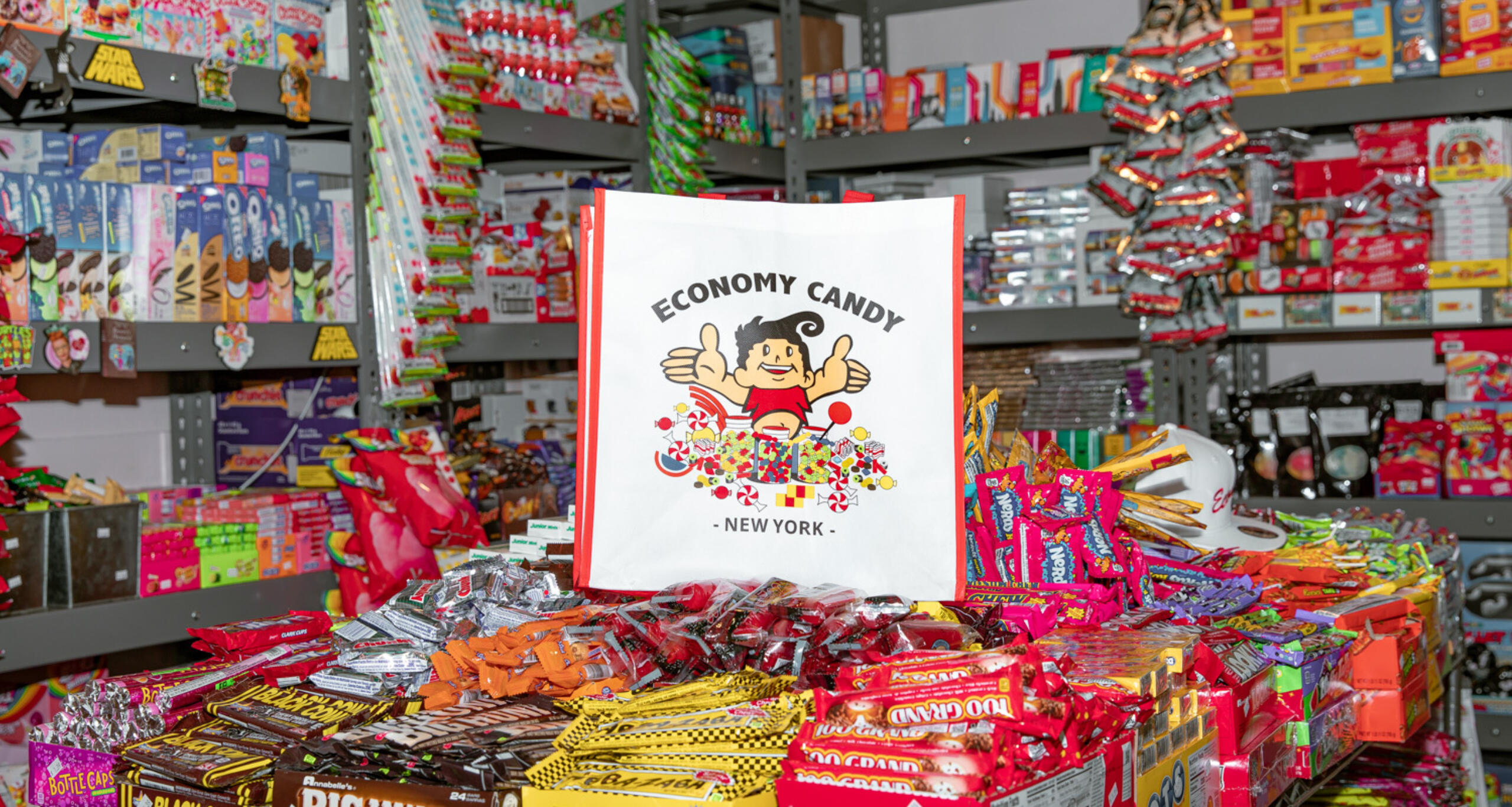 Inside Economy Candy store with hundreds of retail candies on shelves and a table