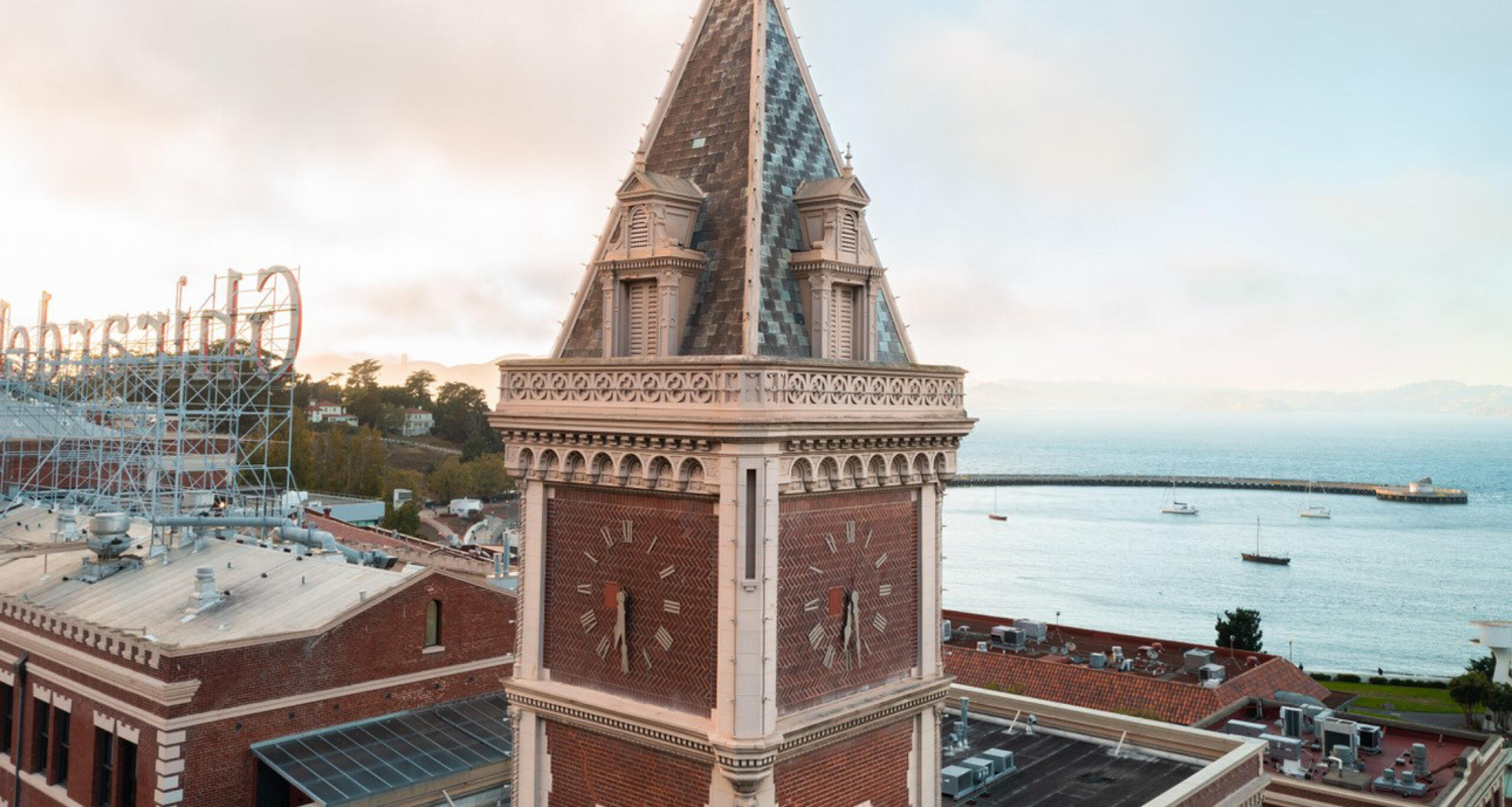 Ghirardelli Square's clock tower, with view of San Francisco Bay in background