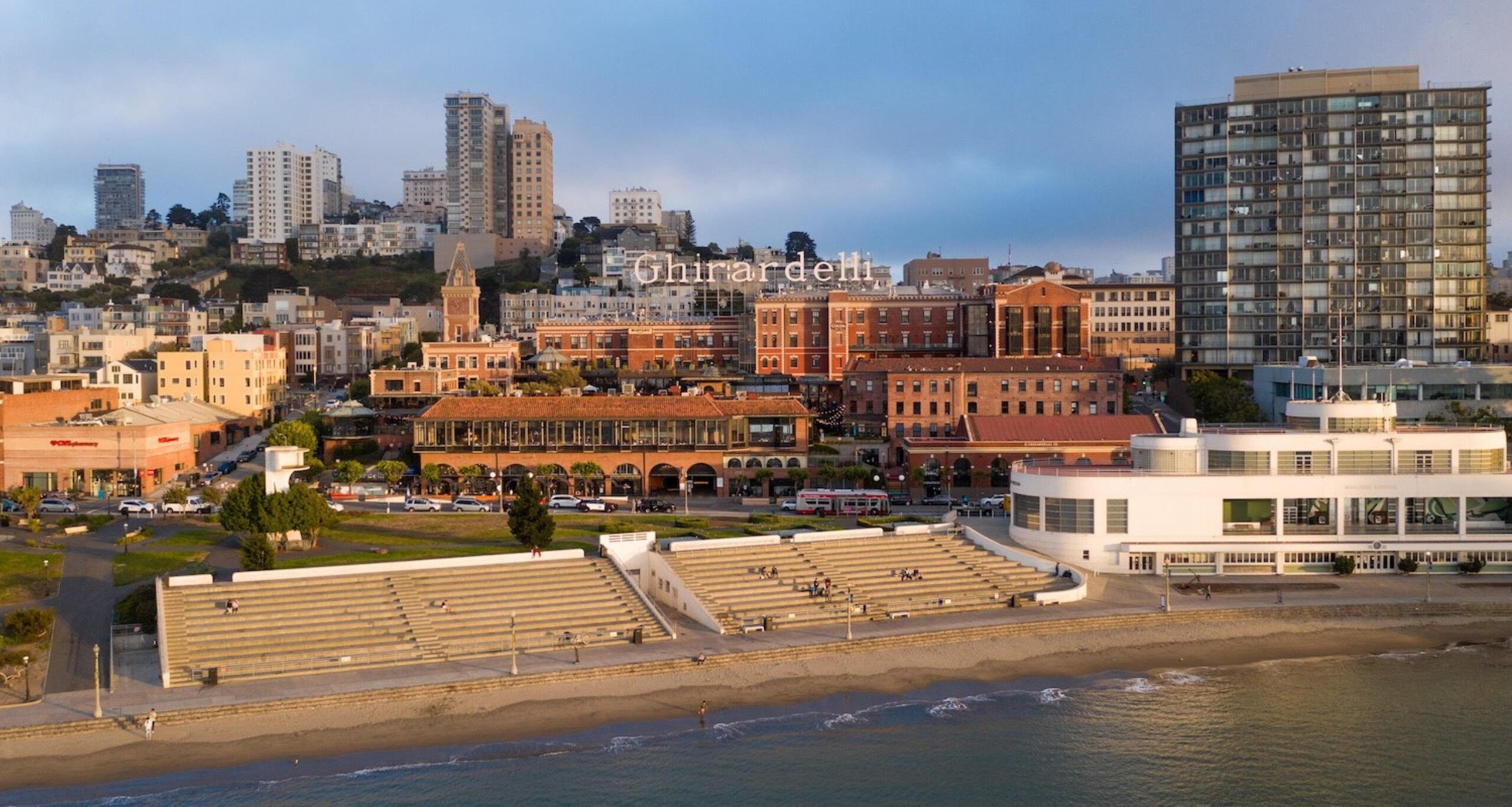 Ghirardelli Square situated on the San Francisco Bay with mid-rise buildings in the background