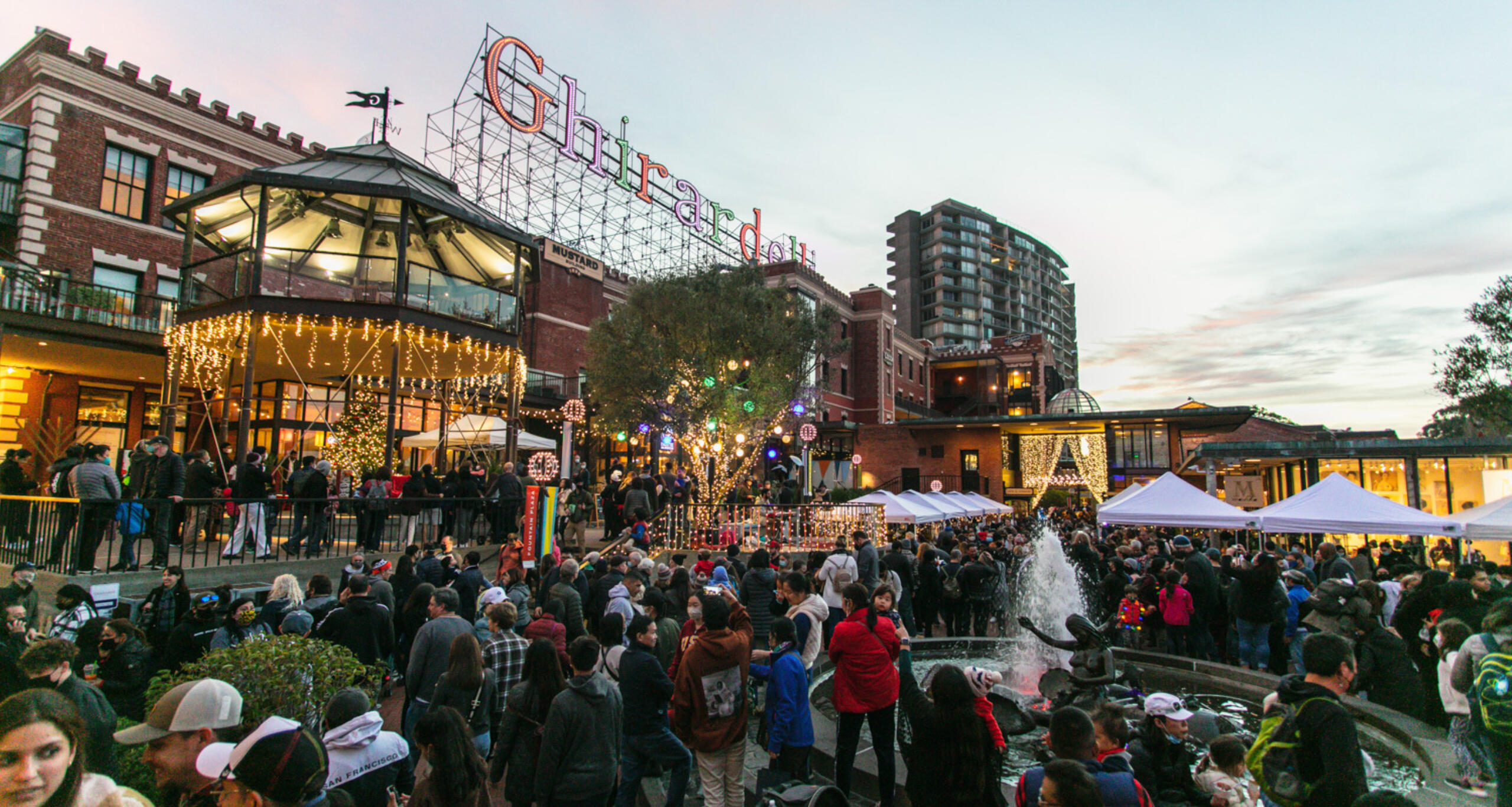 A large crowd of visitors at Ghirardelli Square's holiday celebration