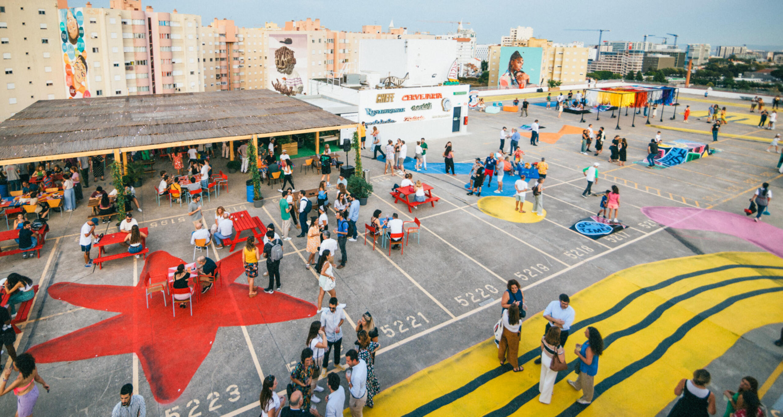 People at event at IDB Lisbon's rooftop terrace
