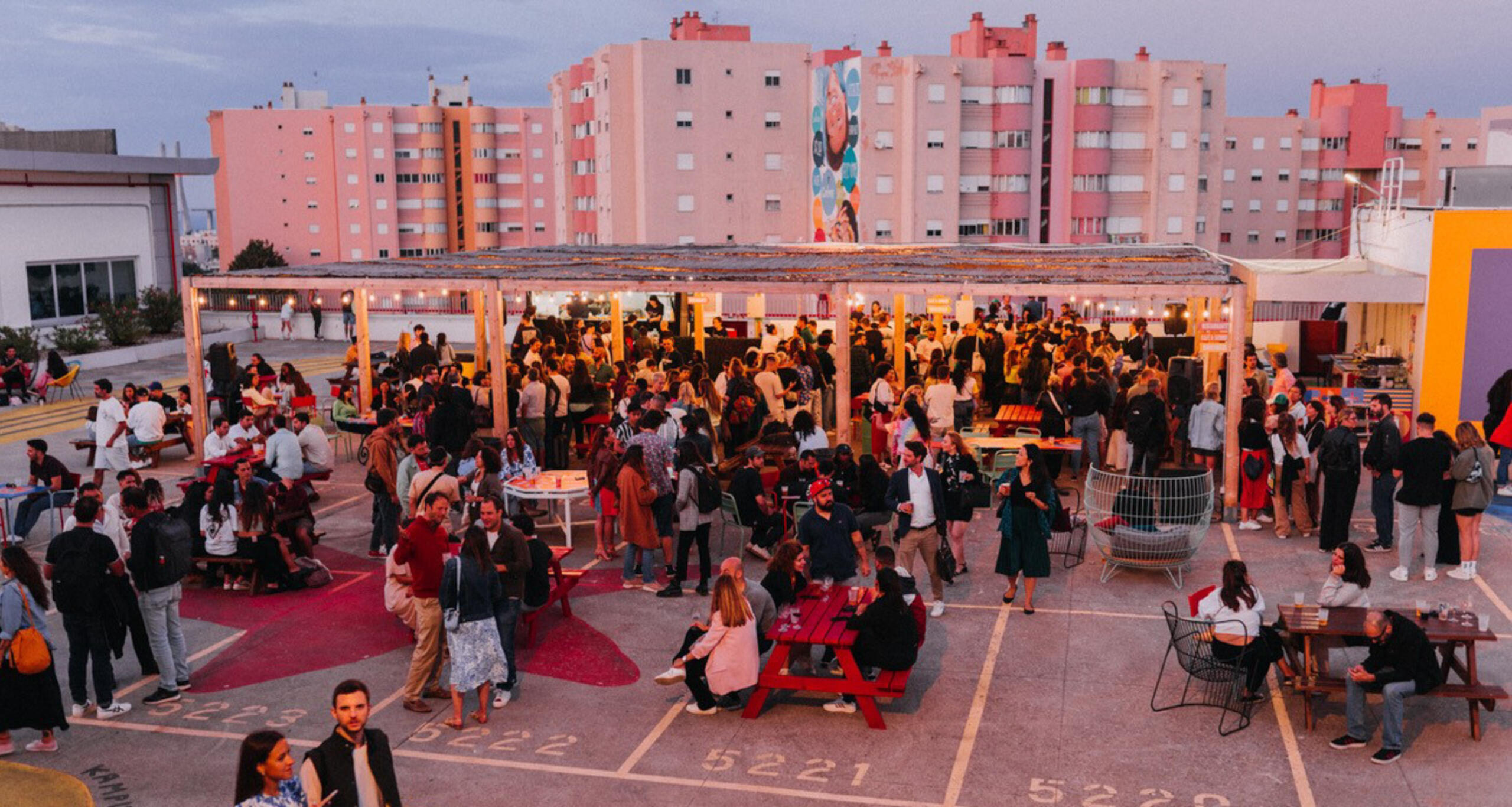 Dozens of people attending an event on the IDB Lisbon rooftop