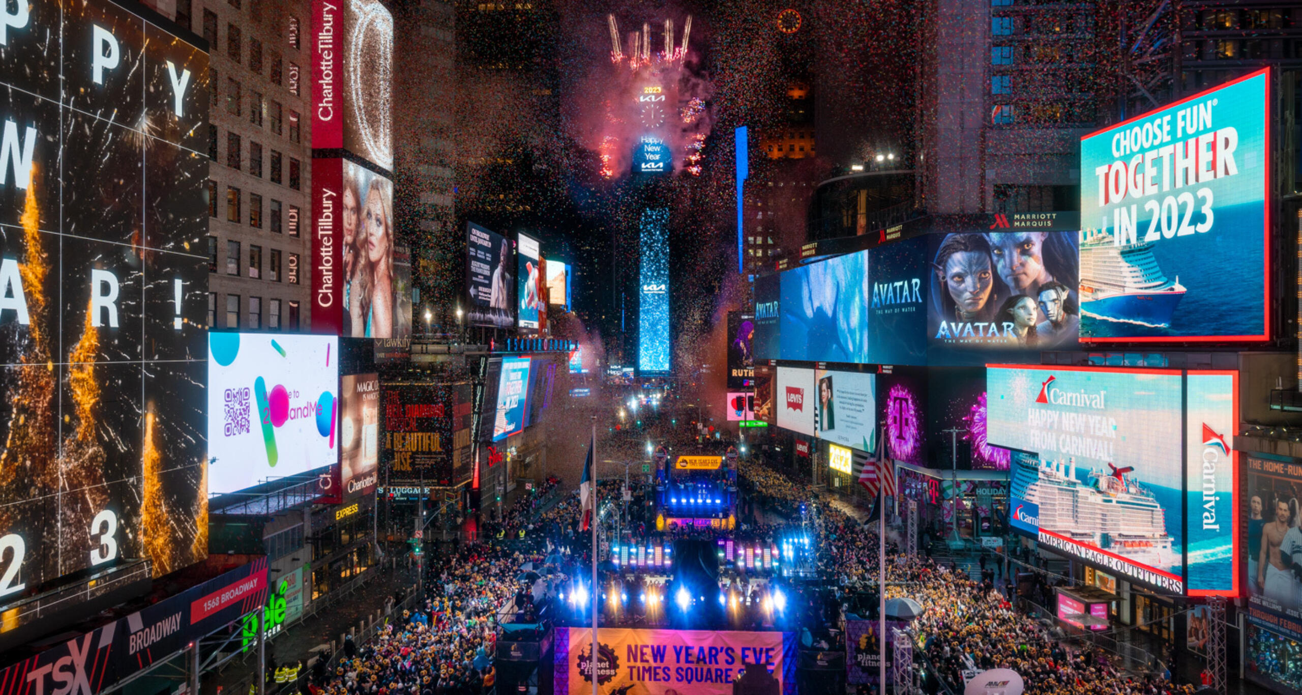 Massive crowd in Times Square for New Year's Eve celebration with ball drop and fireworks on the One Times Square building