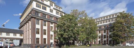 Schanzenstrasse facade with parking lot in foreground lot