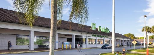 Country Club Plaza exterior of grocery store with pedestrians in driveway