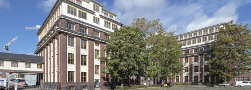 Schanzenstrasse facade with parking lot in foreground lot