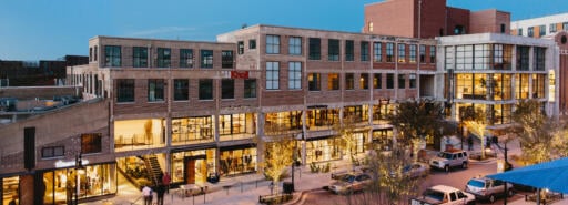 Elevated view of Westside Provisions District at evening with people crossing the street