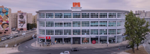 IDB Lisbon building facade with cars on street in foreground