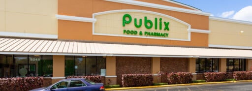 Publix Façade at Tamarac Town Square with car on driveway in front