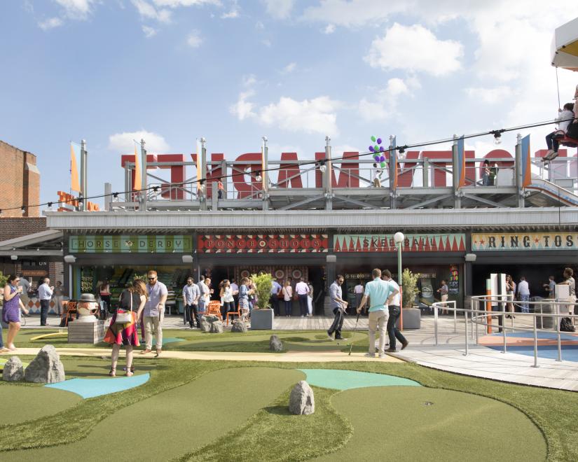 Rooftop of Ponce City Market with people enjoying the amusement park