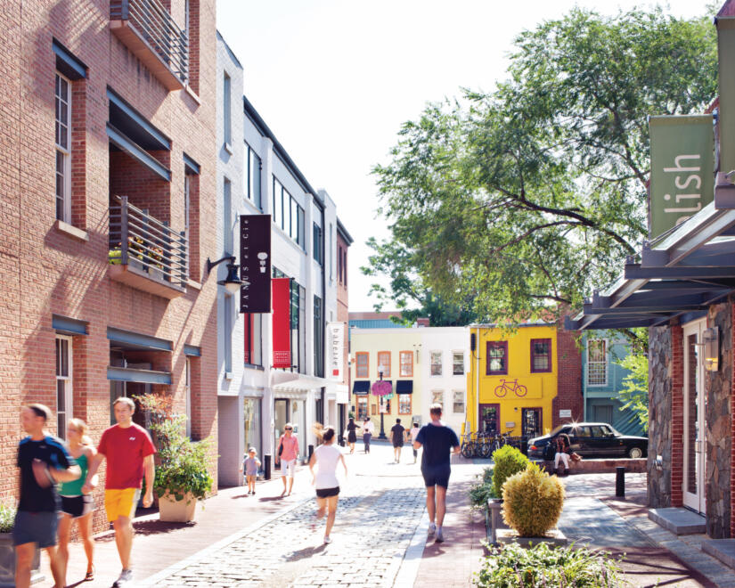 People walking through The Georgetown Renaissance Collection at midday