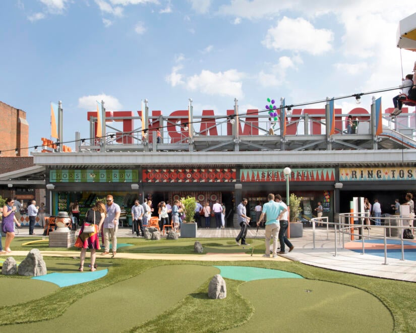 Rooftop of Ponce City Market with people enjoying the amusement park