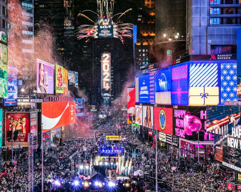 Massive crowd in Times Square for New Year's Eve celebration with ball drop and fireworks on the One Times Square building