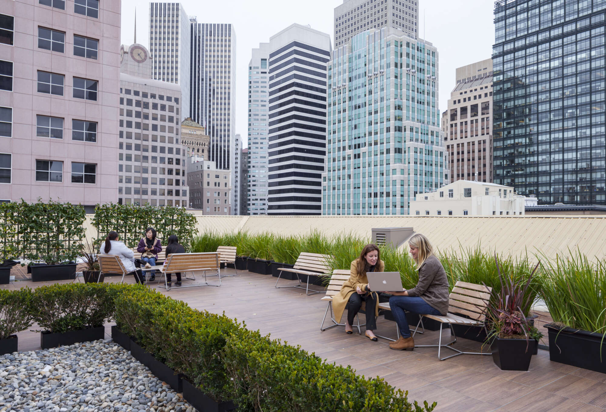 People utilizing the roof deck of Rialto on New Montgomery